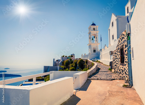 Sunny morning view of Santorini island. Picturesque spring scene of the famous Greek resort Oia, Greece, Europe. Traveling concept background. Traveling concept background.