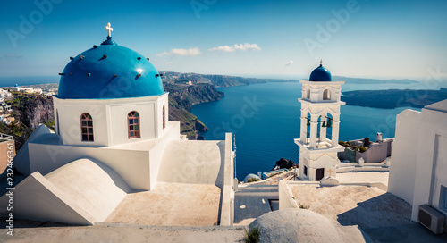 Misty morning view of Santorini island. Picturesque spring scene of the famous Greek resort Fira, Greece, Europe. Traveling concept background.