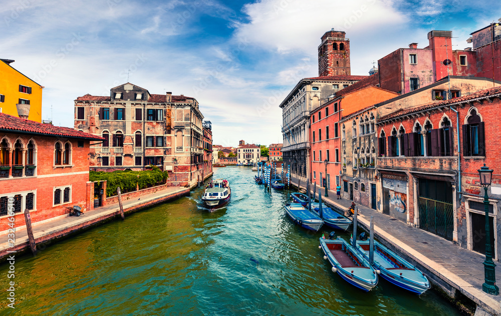 Beautiful spring view of Vennice with famous water canal and colorful houses. Splendid morning scene in Italy, Europe. Magnificent Mediterranean cityscape. Traveling concept background.