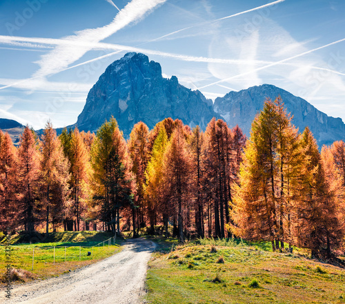 Sunny autumn view of Ambrizola mountain. Colorful morning scene of Dolomite Alps, Cortina d'Ampezzo lacattion, Italy, Europe. Beauty of countryside concept background. photo