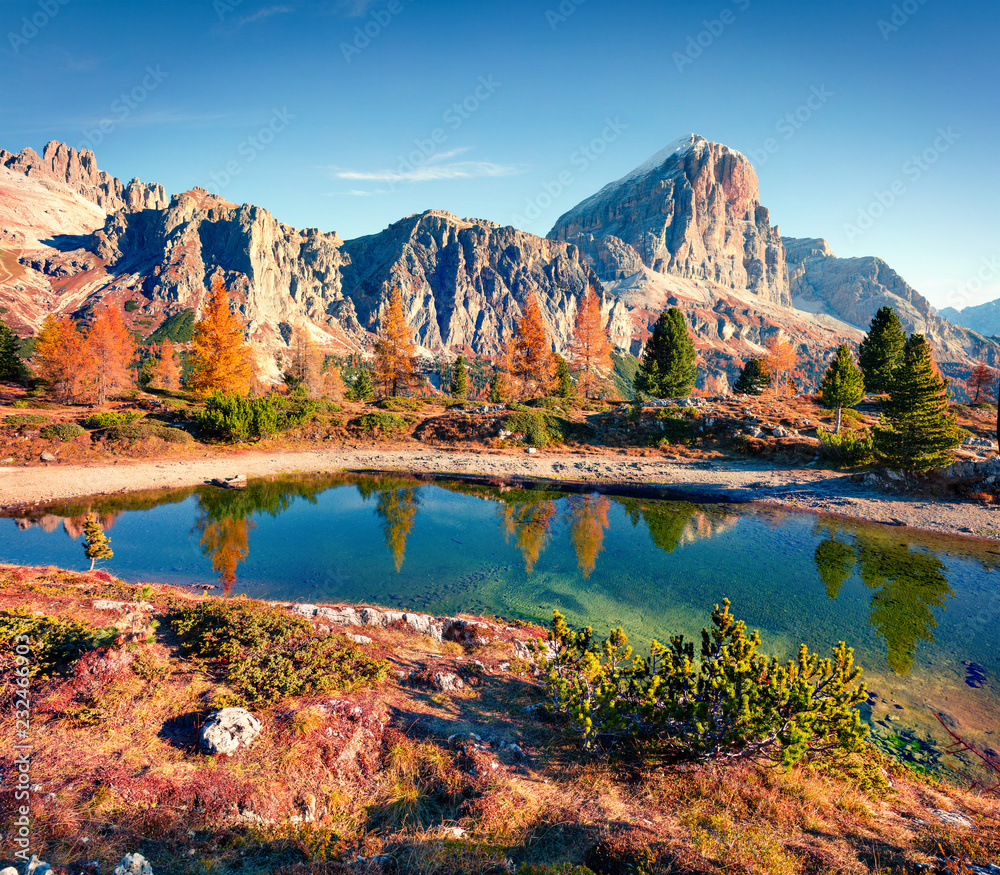 Majestic autumn view of Limides Lake and Lagazuoi mountain. Colorful morning view of Dolomite Alps, Falzarego pass, Cortina d'Ampezzo lacattion, Italy, Europe. Beauty of nature concept background.