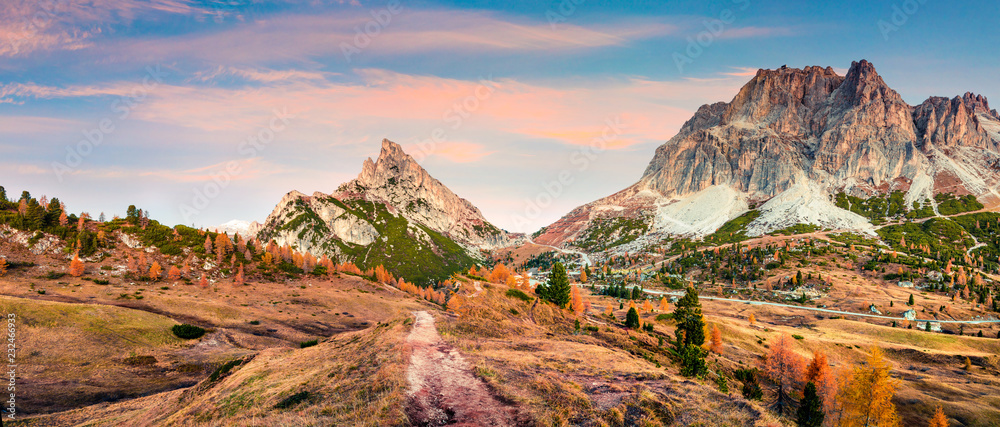 Beautiful autumn view from the top of Falzarego pass with Lagazuoi mountain range. Colorful morning scene of Dolomite Alps, Cortina d'Ampezzo lacattion, Italy, Europe.