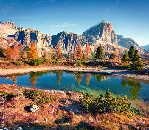 Majestic autumn view of Limides Lake and Lagazuoi mountain. Colorful morning view of Dolomite Alps, Falzarego pass, Cortina d'Ampezzo lacattion, Italy, Europe. Beauty of nature concept background.