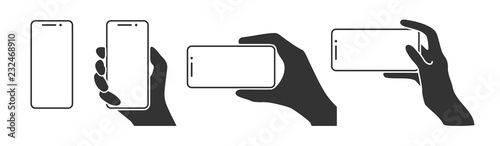 Hands holding a phone in horizontal and vertical positions. Blank screen smartphone for message or photo in various positions. photo