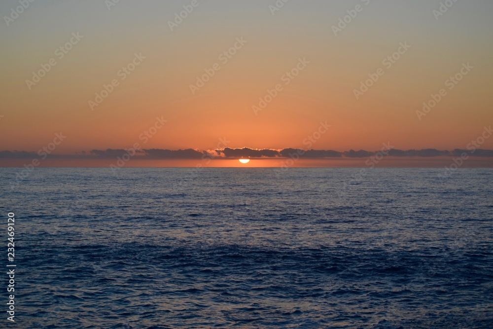 Sunset on the Indian Ocean - sun and clouds on the water Sunset on the Indian Ocean - sun and clouds on the water