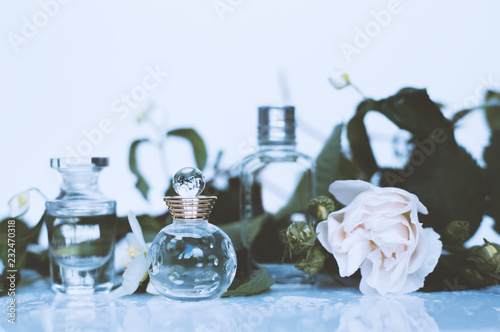 different small perfumes with flowers