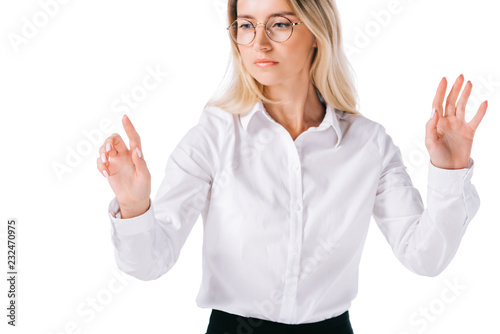 portrait of attractive businesswoman in formal wear gesturing isolated on white