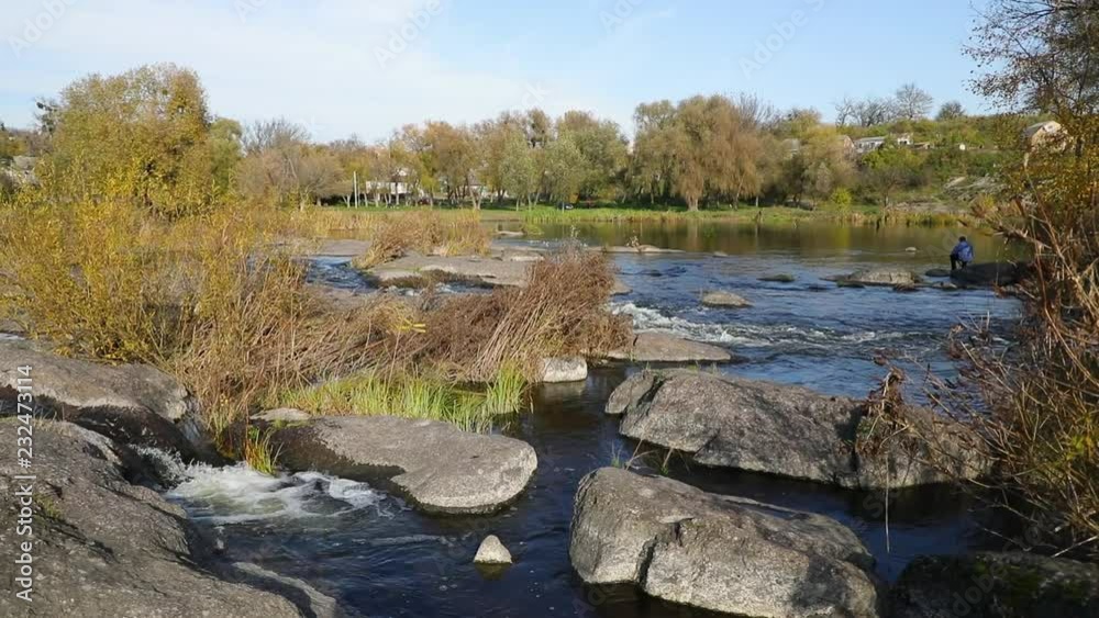 Ros river on the background of fisherman in autumn Ros river on the background of fisherman in autumn