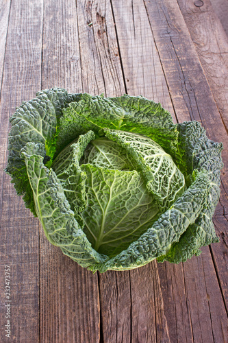 Savoy cabbage kale vegetable on wooden background