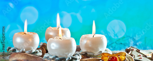 Advent Wreath with Burning Candles on the Blue Background