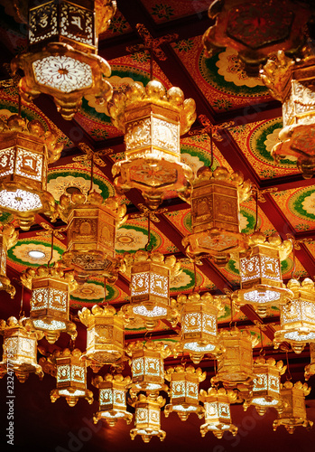 Golden lantern at Singapore Buddha Tooth relics temple with Chinese Architecture