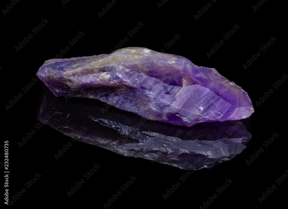 Natural untreated crystal amethyst on a black background