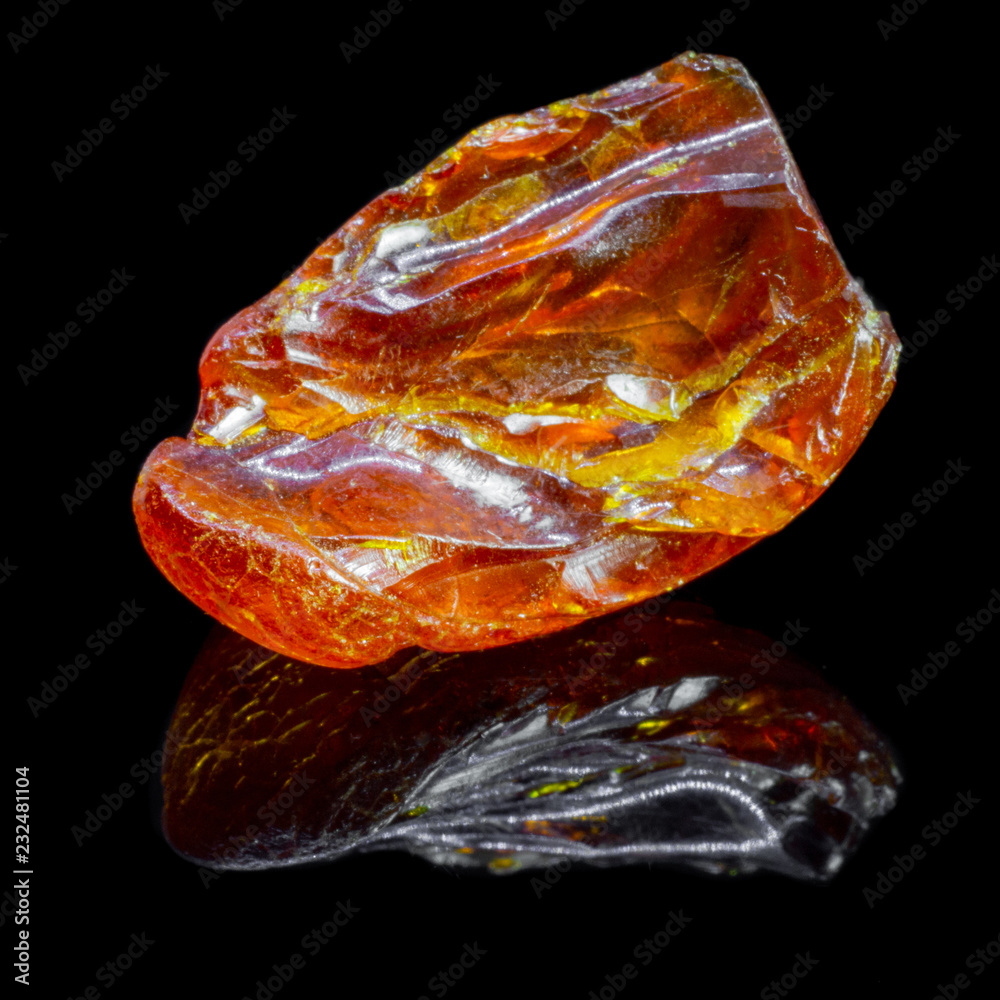 Natural piece of amber on a black background Natural piece of amber on a black background