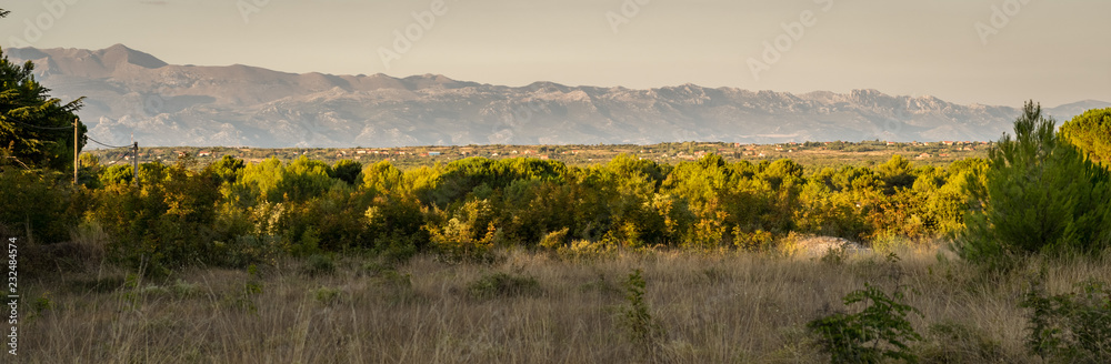 Fototapeta premium Panorama of the Dalmatian mountain range as seen from Zadar, Croatia
