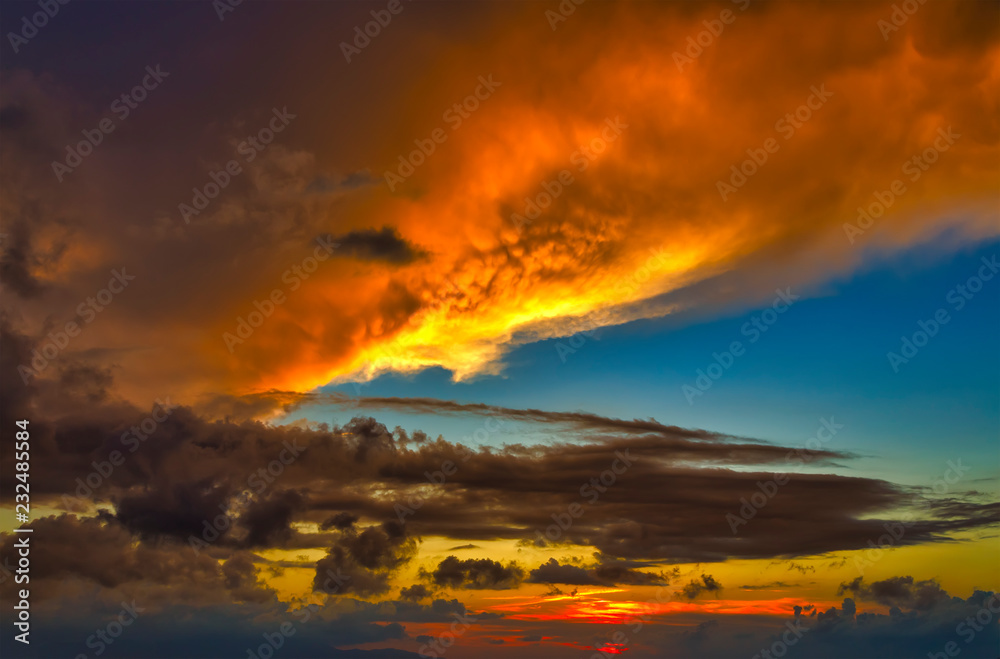 Dramatic sky at sunset with red, yellow and orange colors.
