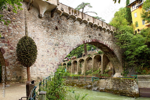 Medieval bridge along the Passirio river in Merano