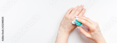 Woman moisturizing her hands with foam lotion