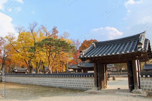Traditional korean wall and gate in the Jeonju Hanok Village in autumn