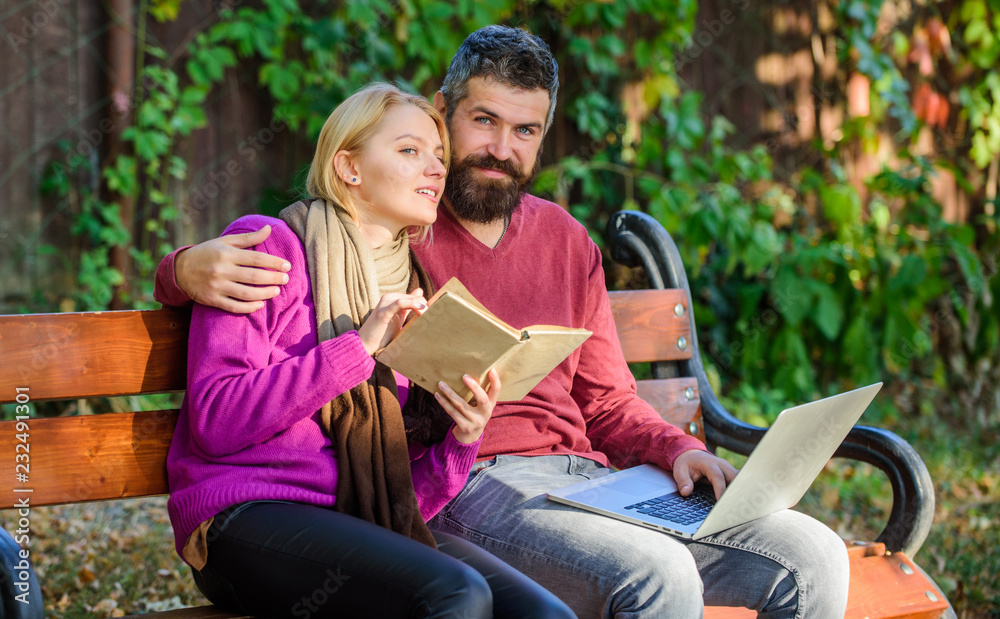 Man and woman use different information storage. Couple spend leisure reading. Information source concept. Couple with book and laptop search information. Share or exchange information knowledge