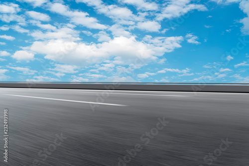 Empty asphalt road and natural landscape under the blue sky