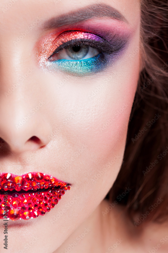 Bright eye makeup red lips in rhinestones. Pink and blue color, colored eyeshadow. Stock Photo | Adobe Stock