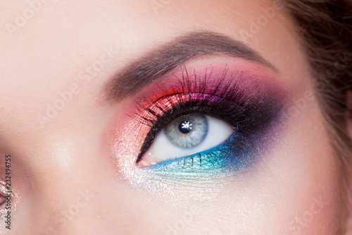 Bright eye makeup. Pink and blue color, colored eyeshadow. photo