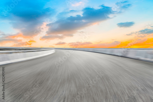 Empty highway asphalt pavement and sky cloud landscape..