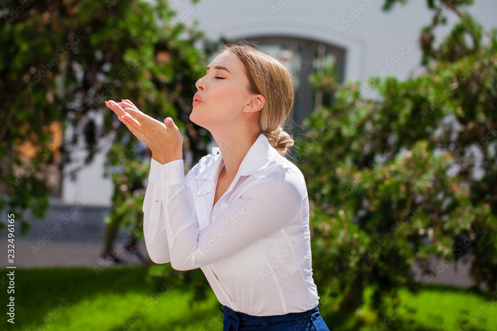 Blow kiss, young caucasian female haired model Blow kiss, young caucasian female haired model