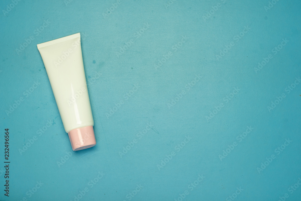 Cosmetic Tube Set on blue background Cosmetic Tube Set on blue background