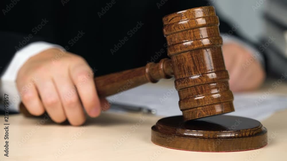 Judge striking gavel, announcing decision, start or finish of