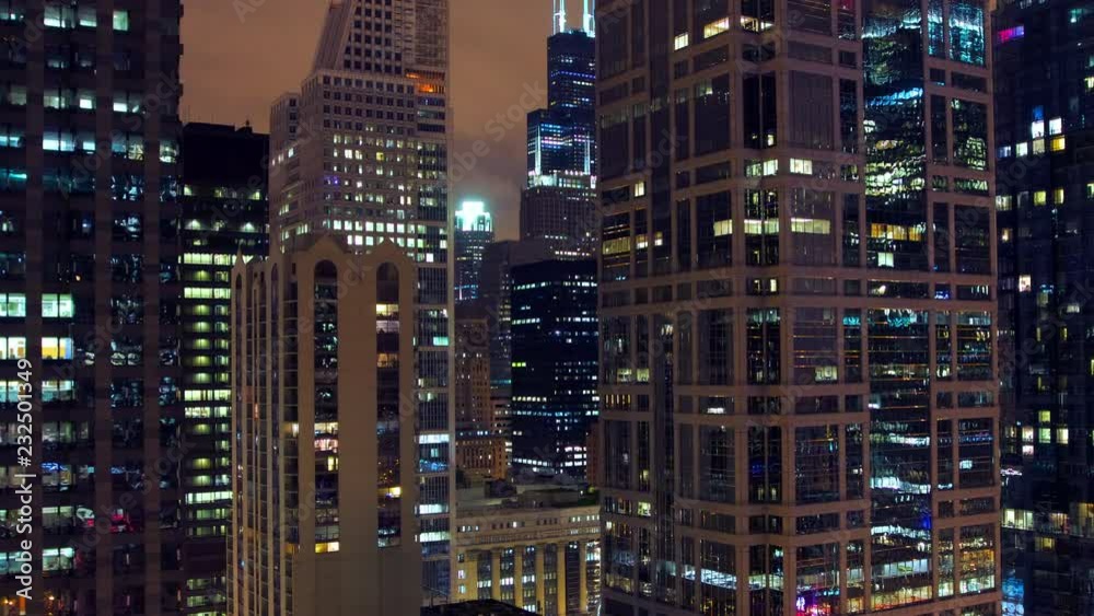 Pan timelapse of offices building at night in Chicago. Filmed from an high rise position Pan timelapse of offices building at night in Chicago. Filmed from an high rise position