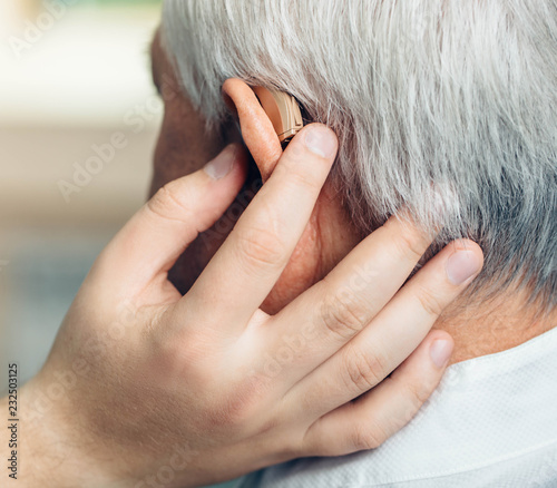 adjusting of a hearing aid for an aged man