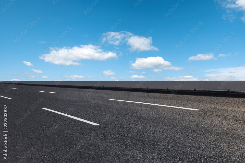 Empty highway asphalt pavement and sky cloud landscape..