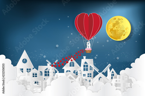 Paper art , cut and digital craft style of the lover in hot air balloons on night village in the cloud and dark blue background as love , wedding and valentine concept. vector illustration
