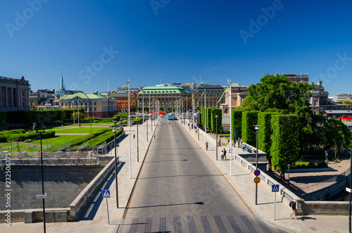 Riksplan green lawn and street with national flags, Stockholm, Sweden