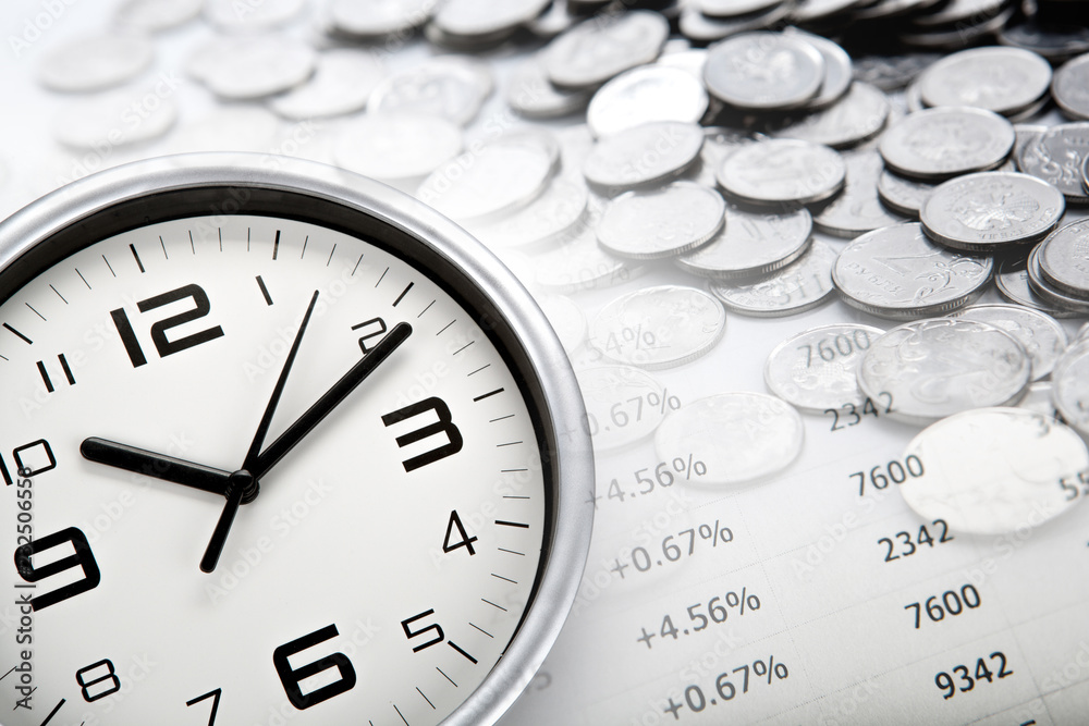 white clock face and Russian ruble coins and digits white clock face and Russian ruble coins and digits