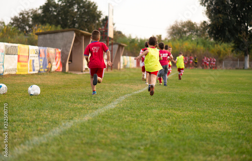 Young soccer players running photo