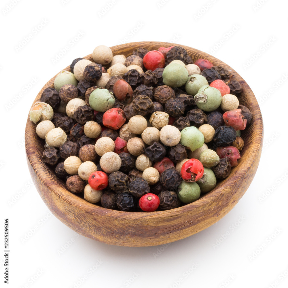 Pepper mix seed on spoon on white background. Pepper mix seed on spoon on white background.
