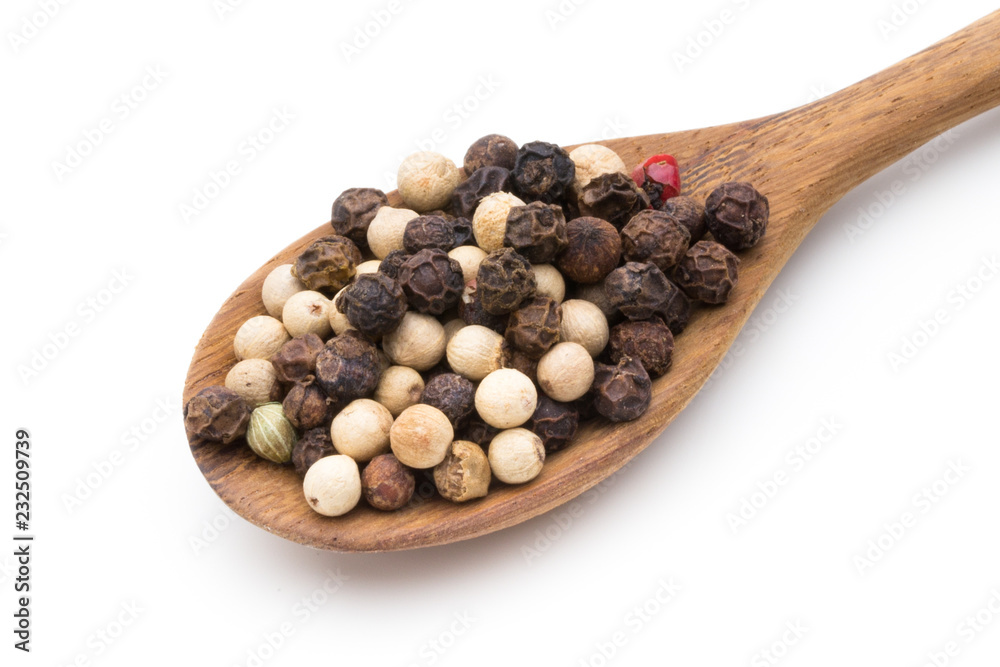 Pepper mix seed on spoon on white background. Pepper mix seed on spoon on white background.