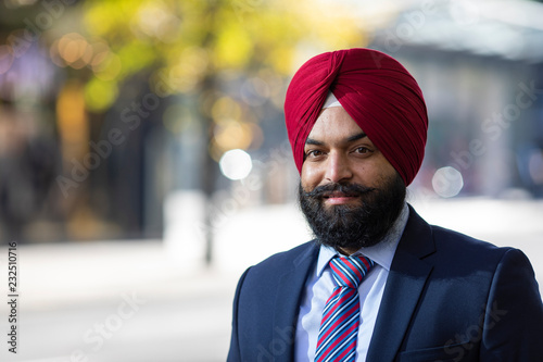 Portrait of Sikh business man looking to camera in the city photo