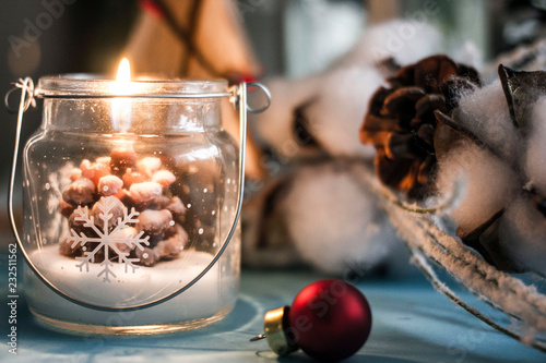 Burning Christmas candle in...