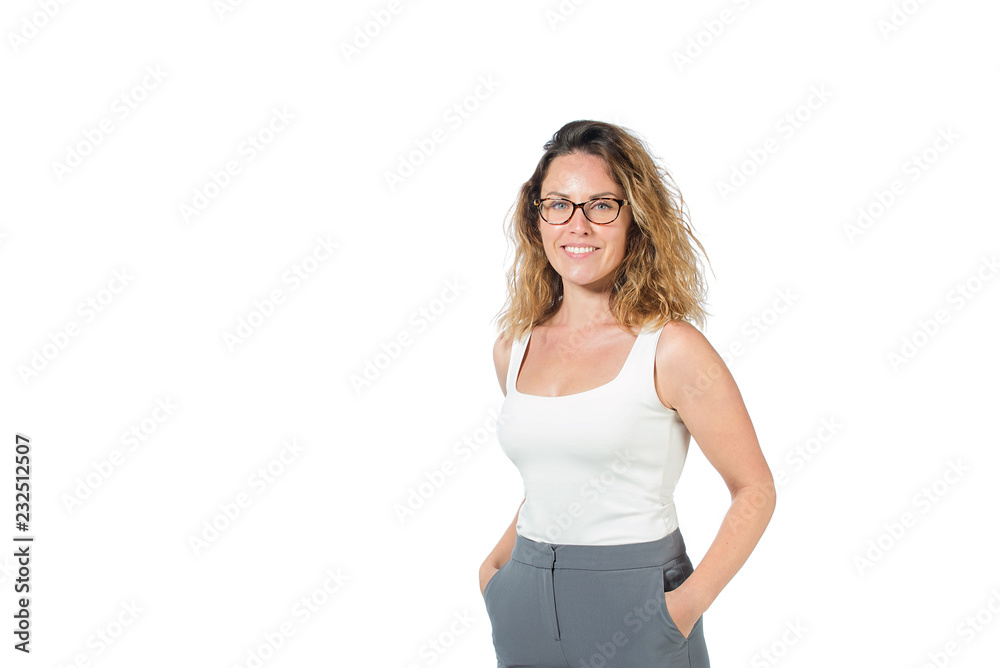 business woman in white shirt and gray pants on a white background. beautiful girl in glasses holds hands in pants, looking at camera . isolated on background, copy space. business woman in white shirt and gray pants on a white background. beautiful girl in glasses holds hands in pants, looking at camera . isolated on background, copy space.