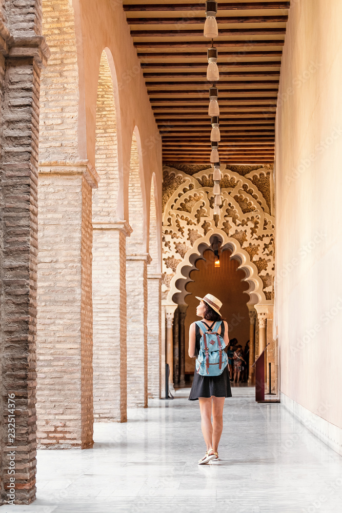 Woman traveler at the Aljaferia, one of the most famous places in Zaragoza. Moorish Islamic palace in mudejar architectural style