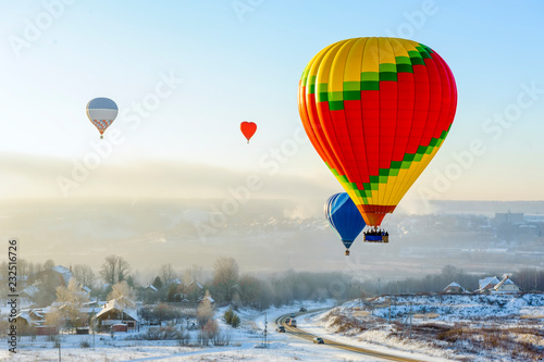 hot air balloons in the sky in winter
