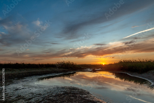 Sunset over the remnants of the water