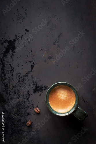 Cup of espresso coffee on dark distressed background with plenty of copy space for your text or menu