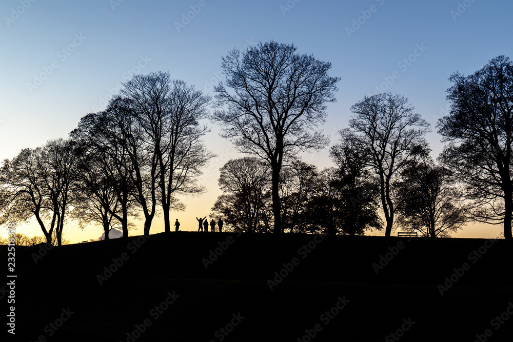 Group of people enjoying sunset Group of people enjoying sunset