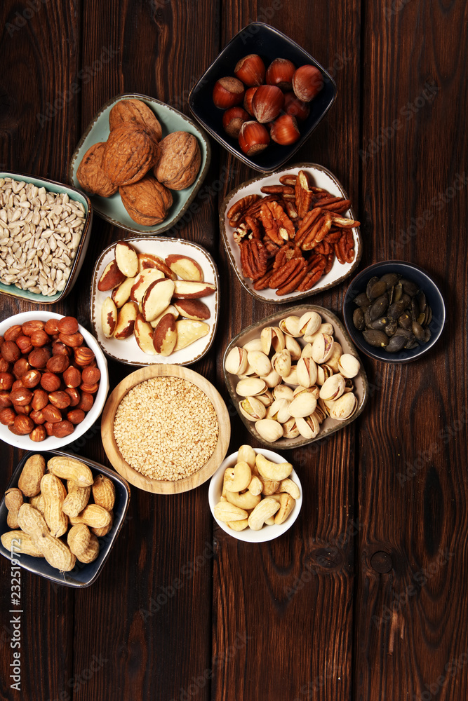 nuts composition on rustic table with walnut and peanut. nuts composition on rustic table with walnut and peanut.