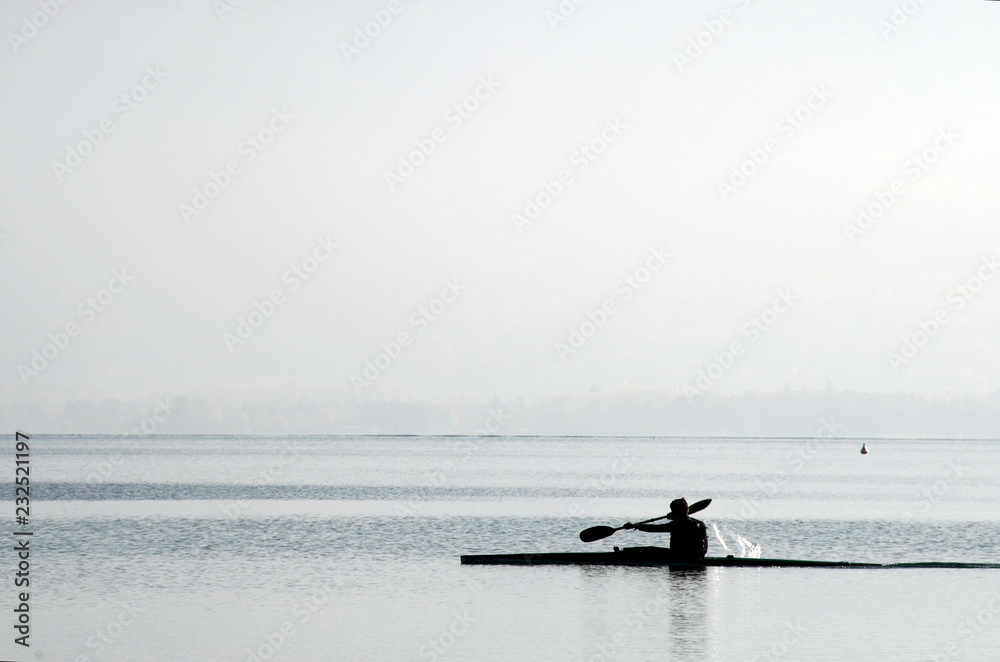 Kayaker on kayak on Annecy lake Kayaker on kayak on Annecy lake