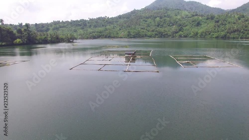 San Pablo City, Laguna, Philippines - October 2, 2017: floating shanty, fish cages built on Mohicap lake. drone aerial shot photo